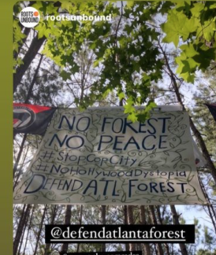Stop Cop City flying the Antifa flag in their forest occupation